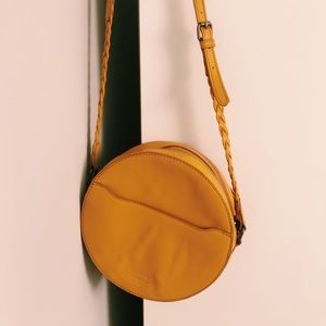 Trendy rounded yellow purse
